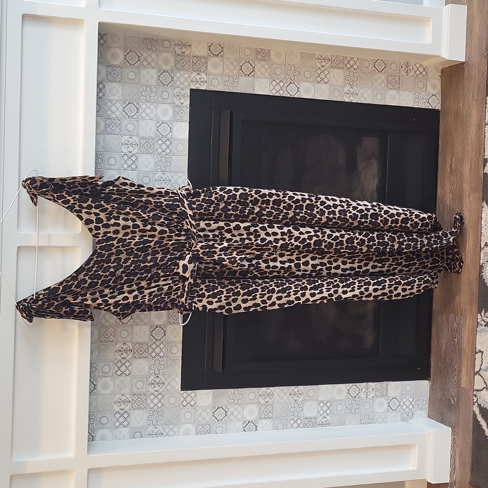 Asymmetrical ankle lenth jump suit with belt and pockets.  Size XL leopard print